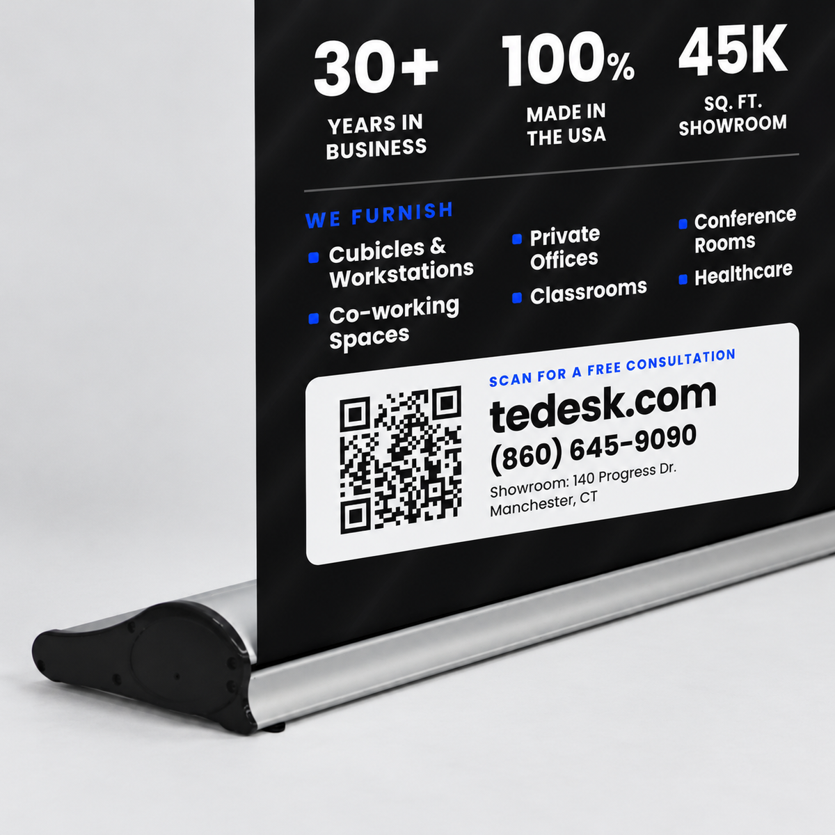 A black Tedesk retractable display stand with a printed promotional sign, shown on a white background. The sign features white and blue text highlighting company statistics, services, and a QR code for a free consultation.