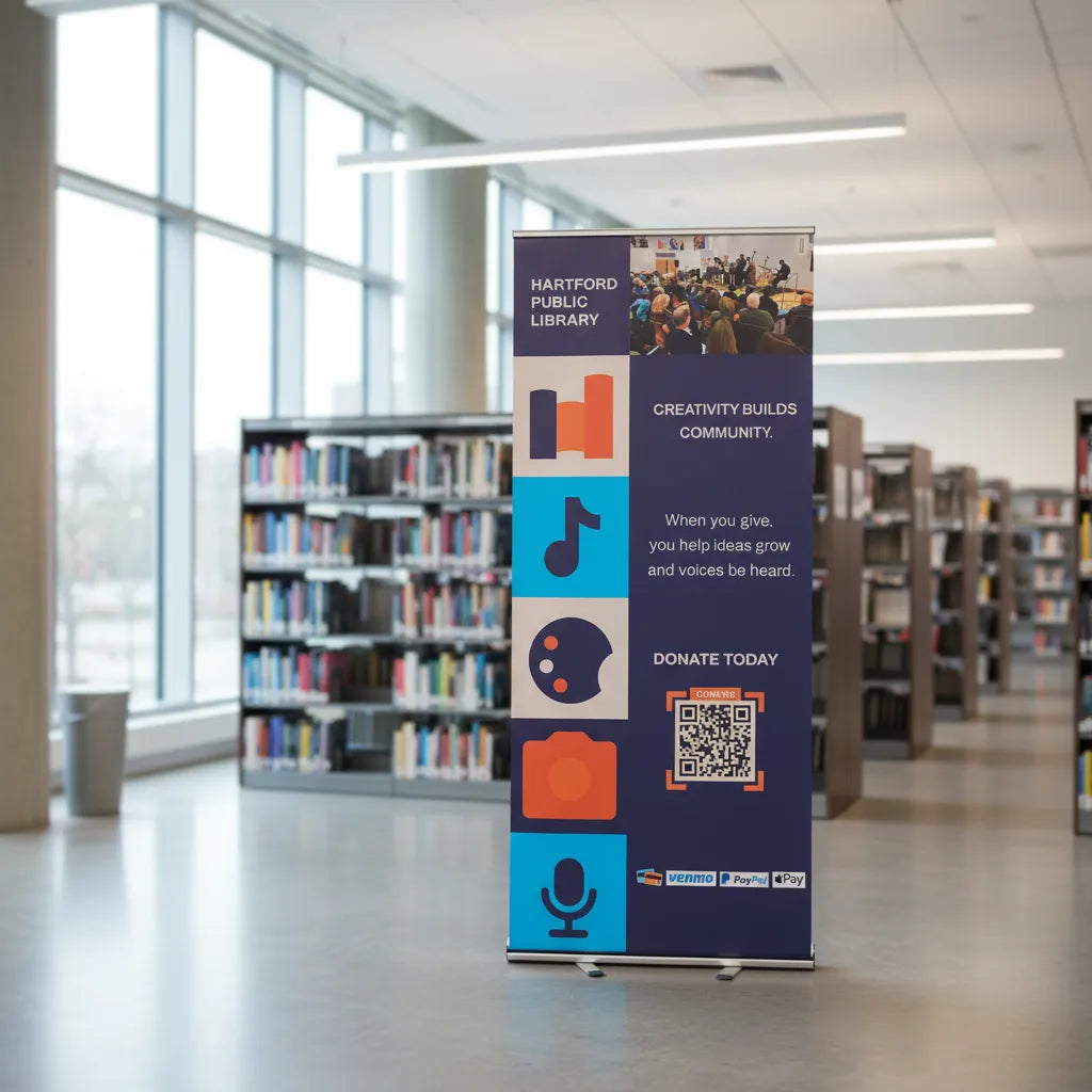 Retractable banner in a library setting with bookshelves in the background